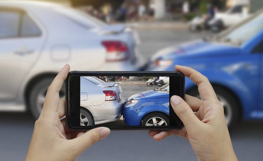 A Person taking a Photo of a Car Accident with Mobile