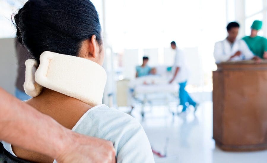 patient with neck collar in hospital for treatment for catastrophic injuries