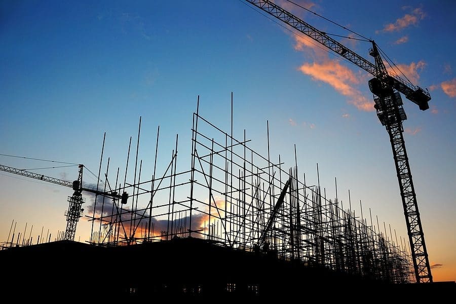 An Image of a construction site with large cranes working.