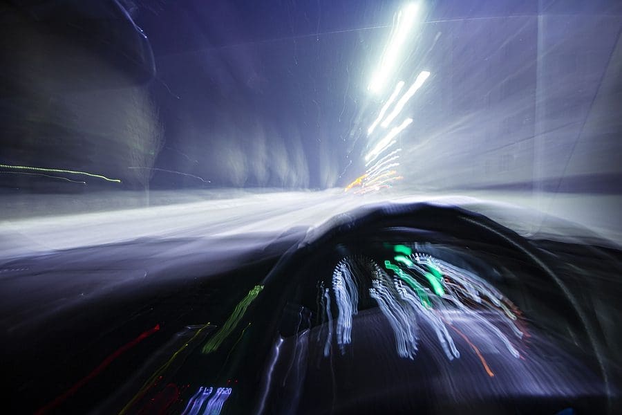 blur motion inside car light trail represent moving car or drunk driver