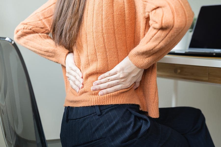 girl pain with back pain ache from computer work