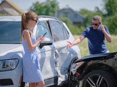 Angry Woman And Man Drivers Of Heavily Damaged Vehicles Calling