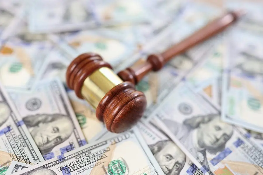 Close-up Of Judge Gavel And Pile Of Money Banknotes. Judgement