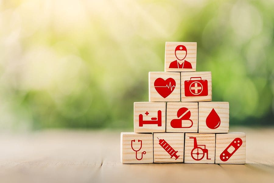 Lay Out Wooden Blocks With Icons Of Medical Health. Health Insur