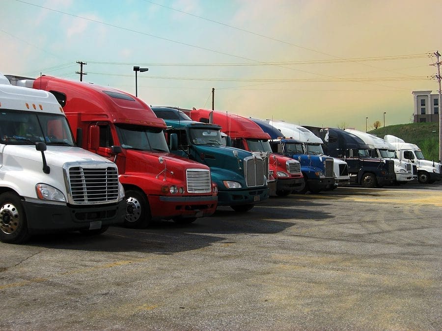Truck stop with several parked semi trucks