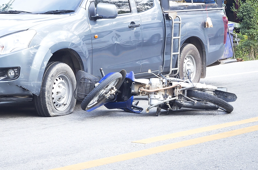 aftermath of a motorcycle accident involving a collision between a truck and a motorcyclist