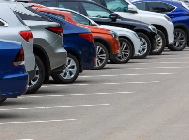 Line of different types of cars parked, some of which tend to cause more accidents than others