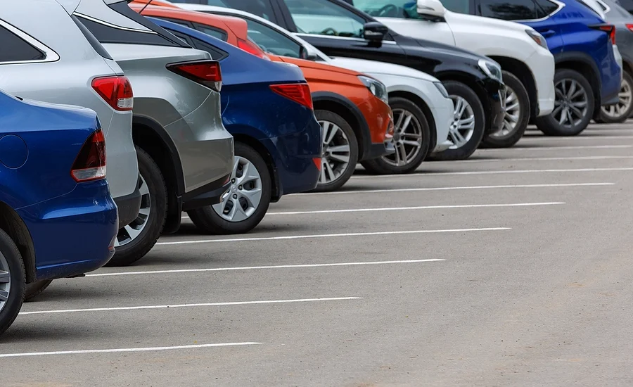 Line of different types of cars parked, some of which tend to cause more accidents than others