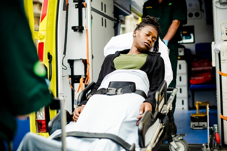 woman beinng loaded onto an ambulance by paramedics after a Lealman car crash