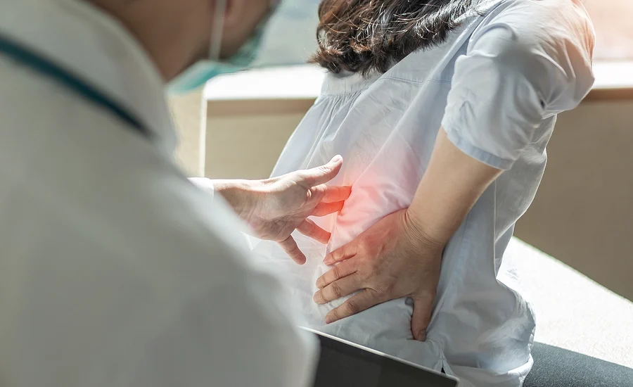 doctor examining patient for neck and back injuries after an accident