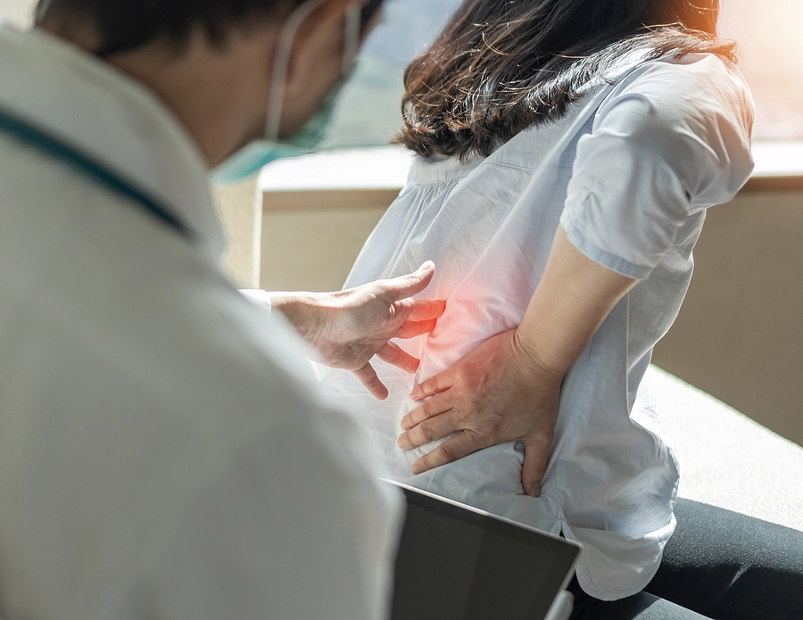 doctor examining patient for neck and back injuries after an accident