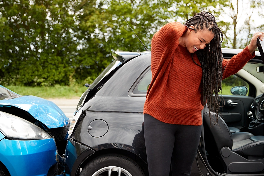 largo woman holding her neck in pain after a rear end car accident caused a whiplash injury