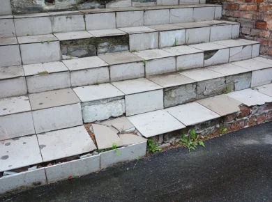 unsafe stairs with broken tiles and uneven steps