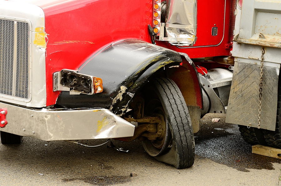 aftermath of a gulfport truck accident where a semi jackknifed because a worn-out tire blew