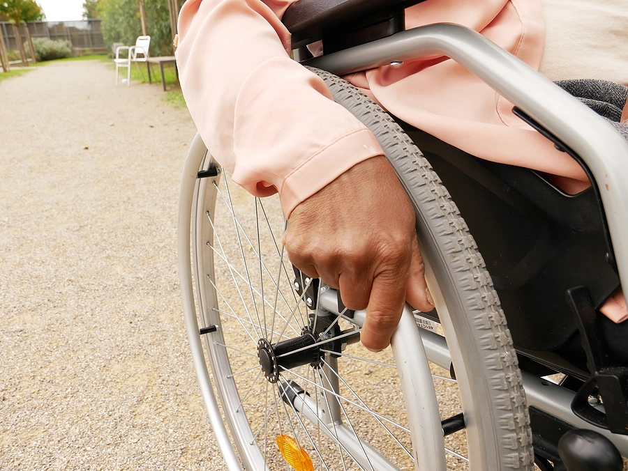 young woman in a wheelchair recovering from largo slip and fall injuries